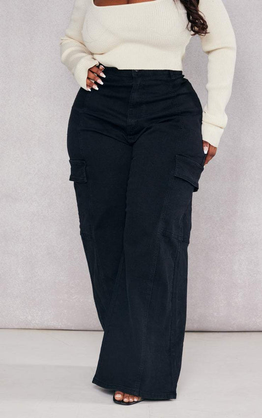 Plus Black Cargo Wide Leg JeansReimagine utilitarian style with these black, wide-leg cargo jeans. Cut from durable denim, these jeans offer a contemporary take on a classic silhouette. The multipRedemption By Ashley NorthPlus Black Cargo