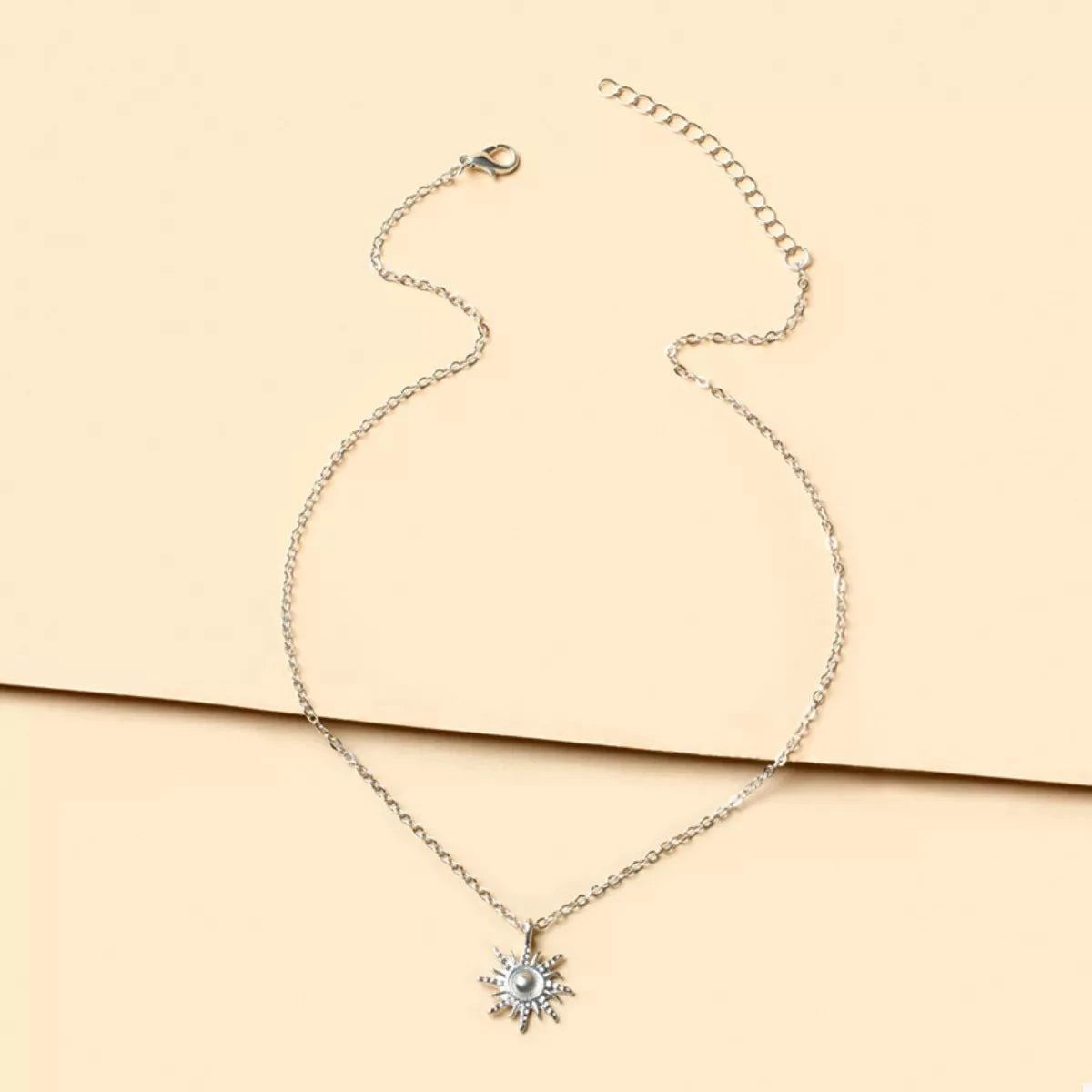 Sunburst Pendant NecklacePieces:1-piece
Material:18K Gold-Plated,Zinc alloy,Silver-plated
Care instructions:Avoid wearing during exercise, as sweat will react with the jewelry to produce silSunburst Pendant Necklace
