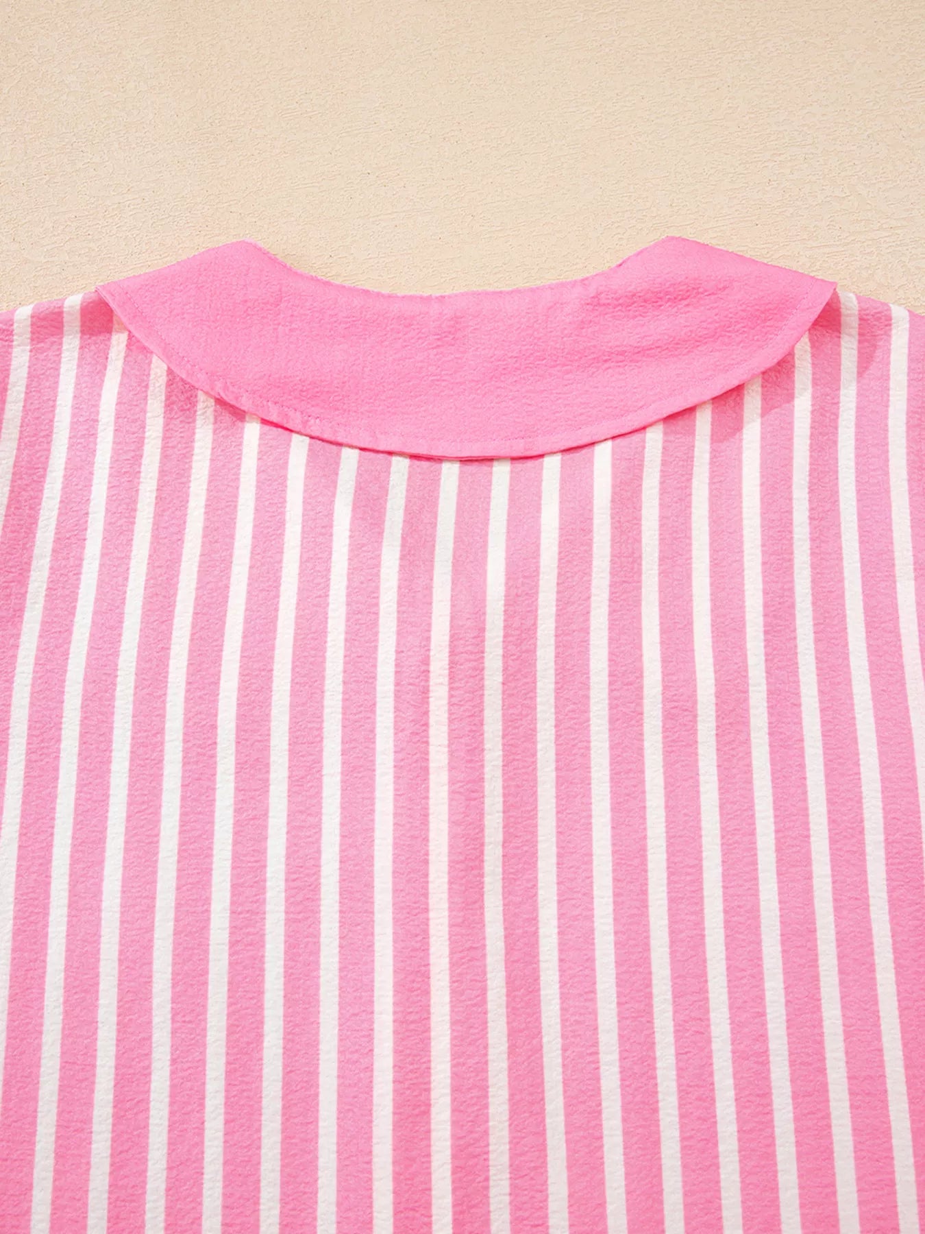 Pink and white striped buttoned front sleepwear top with long sleeves and collar