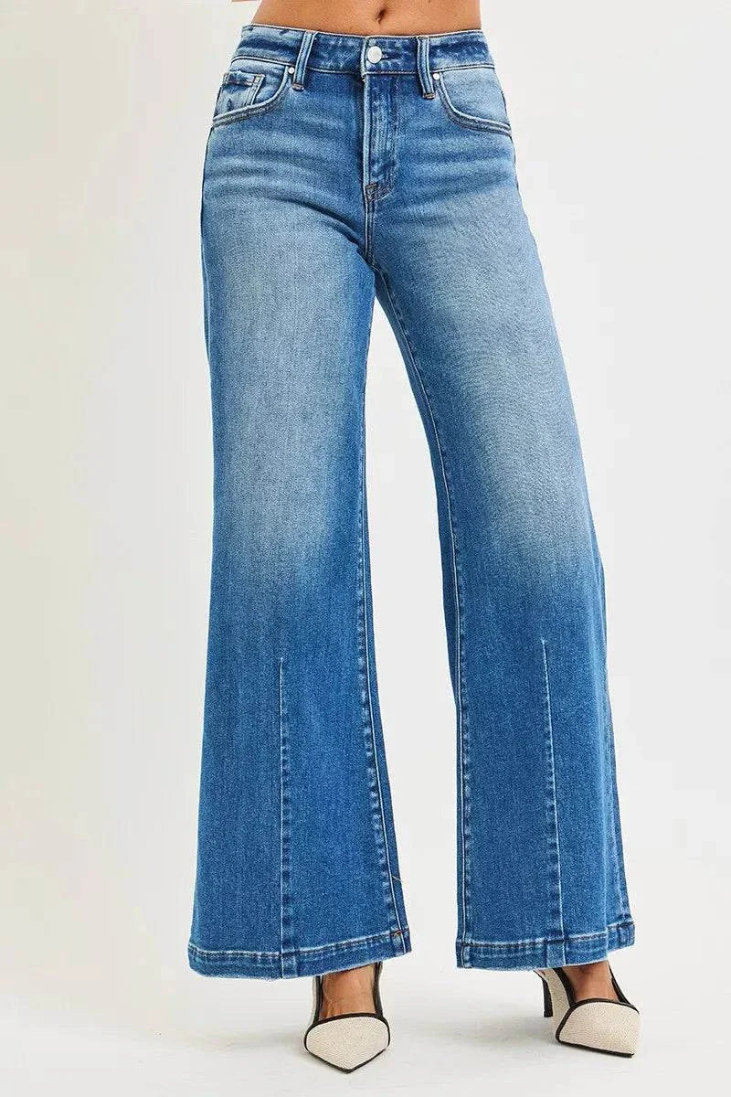 RISEN Full Size Mid Rise Wide Leg Jeans with Flared Look Plus SizeThese Mid Rise Wide Leg Jeans With Flared Look are a statement piece for a retro-inspired outfit. The mid rise waist provides a flattering fit and silhouette. The wiRISEN Full Size