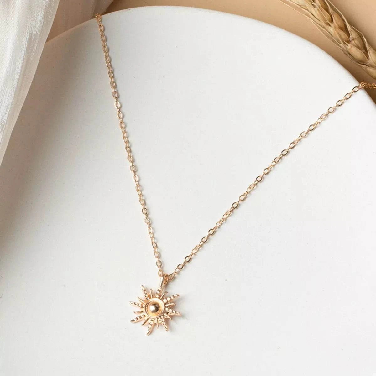 Sunburst Pendant NecklacePieces:1-piece
Material:18K Gold-Plated,Zinc alloy,Silver-plated
Care instructions:Avoid wearing during exercise, as sweat will react with the jewelry to produce silSunburst Pendant Necklace
