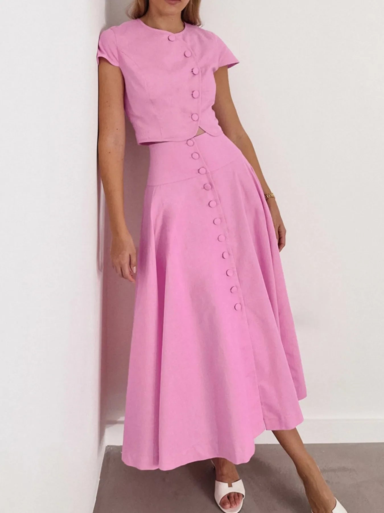 Pink short sleeve top and buttoned skirt set in 100% cotton with no stretch, machine washable.