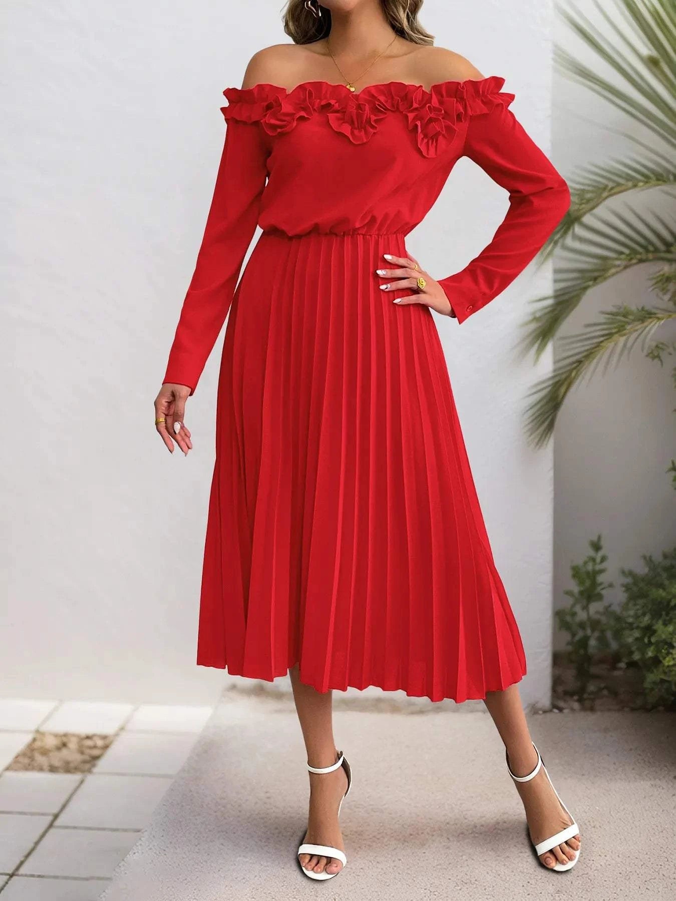 Woman wearing red off-shoulder ruffle pleated midi dress with long sleeves and white heels
