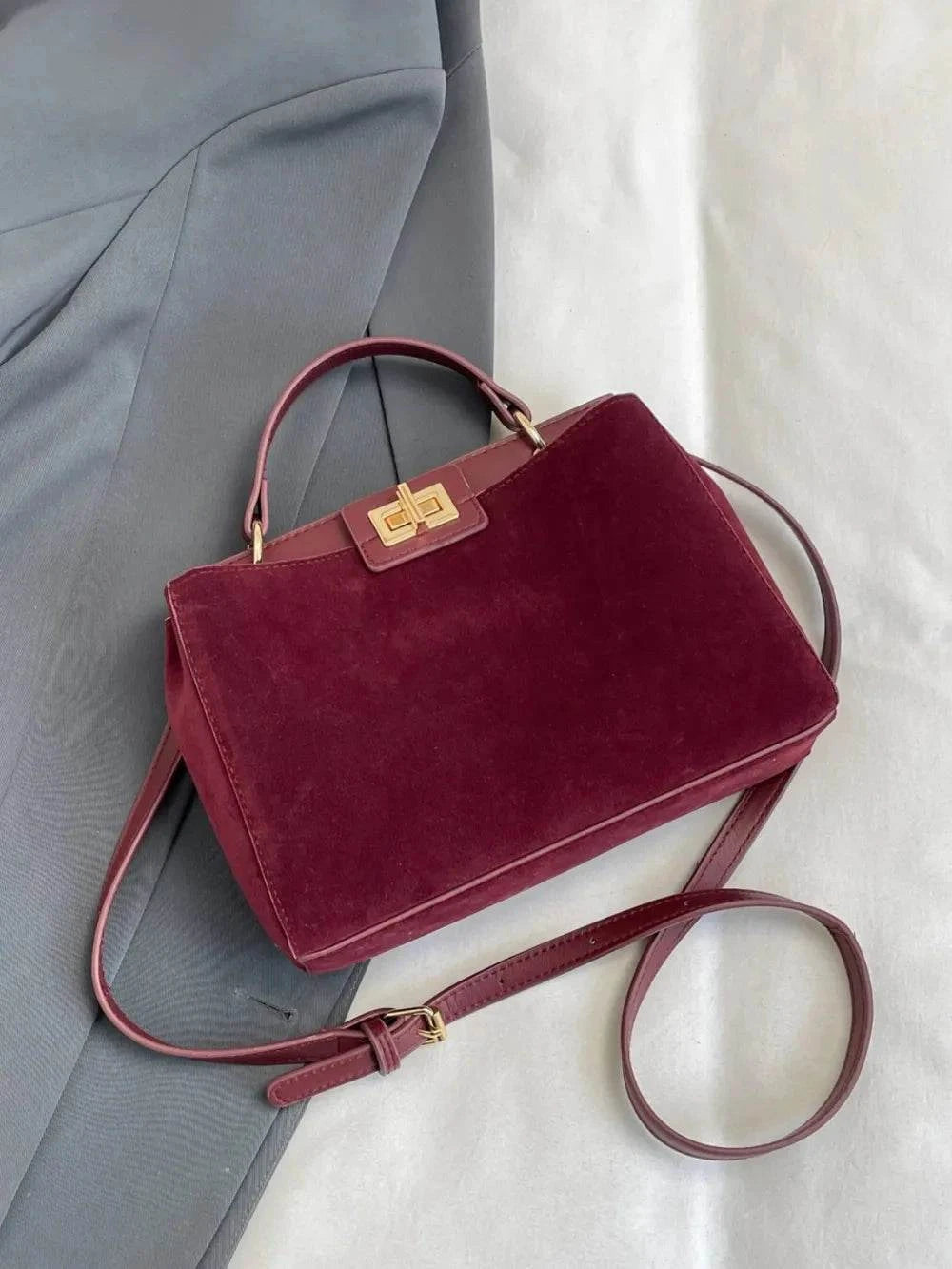 Solid Color Handbag with Removable Strap for Versatile Styling.