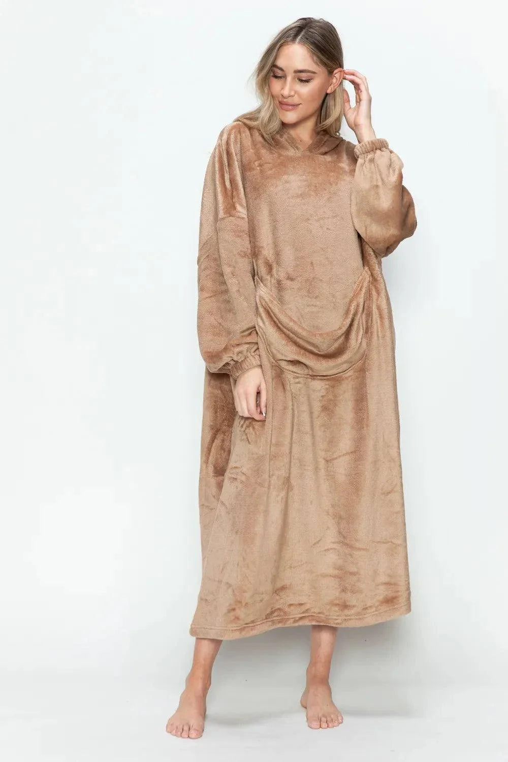 woman wearing cozy brown hooded midi lounge dress with pockets standing barefoot