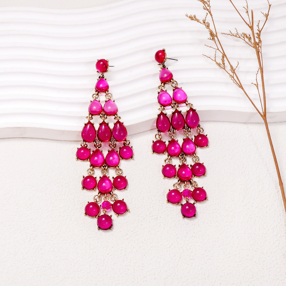 Alloy and rhinestone teardrop earrings with pink stones in cascading design