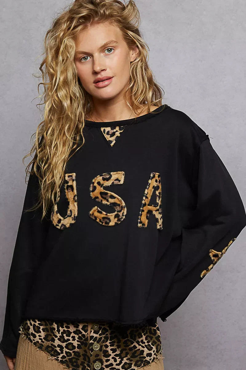 POL Round Neck long sleeve black sweatshirt with USA letter leopard animal patch and raw hem in relaxed fit