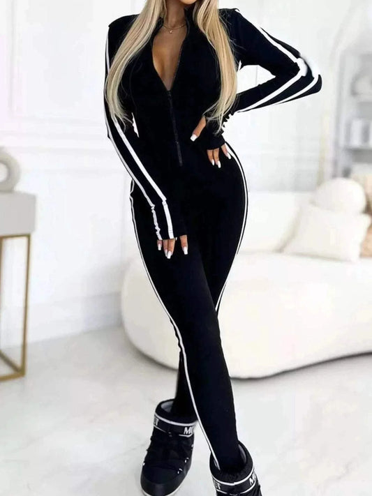 Plus size full length black stripe zip-front jumpsuit with long sleeves and white side stripes
