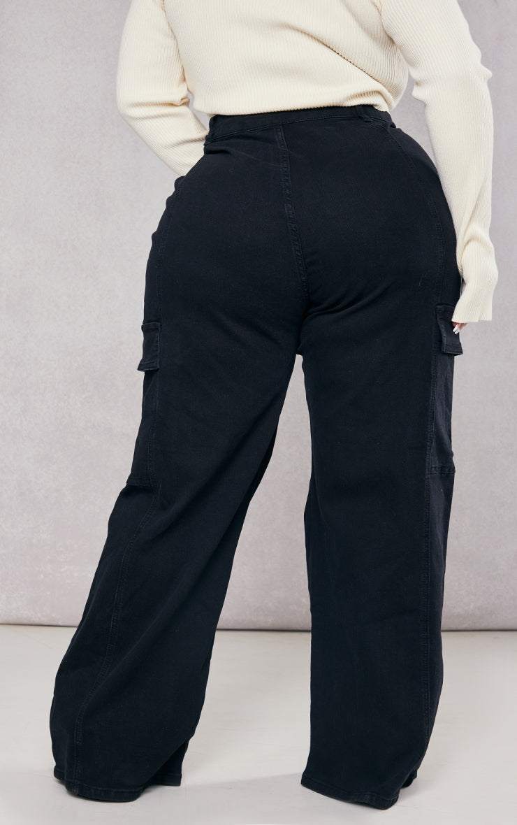 Plus Black Cargo Wide Leg JeansReimagine utilitarian style with these black, wide-leg cargo jeans. Cut from durable denim, these jeans offer a contemporary take on a classic silhouette. The multipRedemption By Ashley NorthPlus Black Cargo
