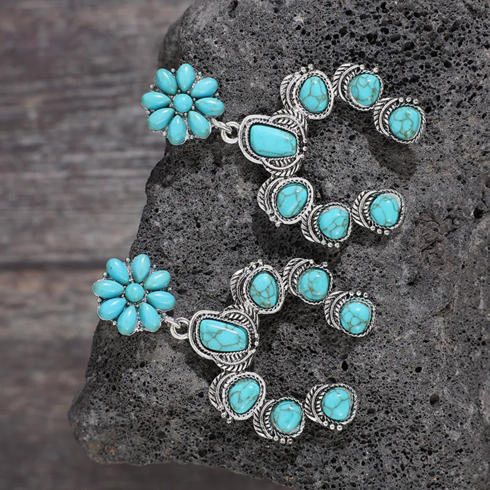 Artificial turquoise alloy dangle earrings with flower and oval stone design