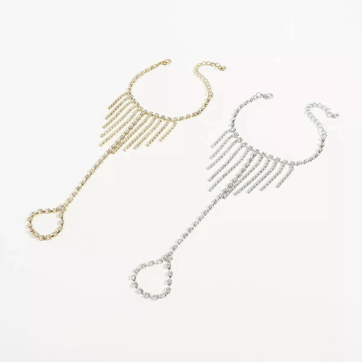 Rhinestone Fringe Hand Chain BraceletPieces:1-piece
Material:18K Gold-Plated,Iron,Rhinestone,Silver-plated
Care instructions:Avoid wearing during exercise, as sweat will react with the jewelry to producRhinestone Fringe Hand Chain