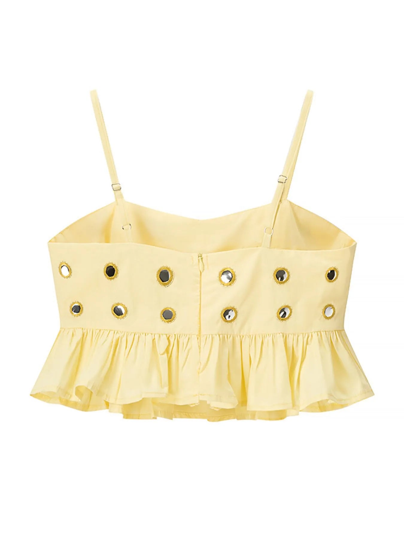 Yellow eyelet cami with ruffled hem and circular cutouts, made of polyester blend.